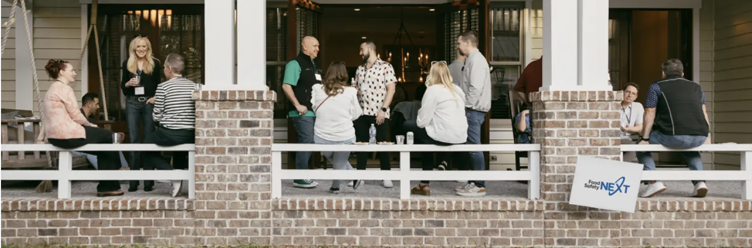 Food Safety Next attendees networking on a porch